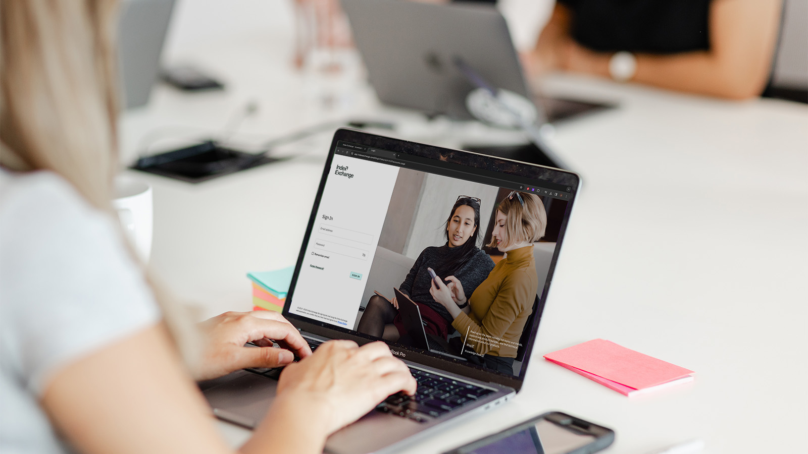 Woman using Index Exchange platform on laptop