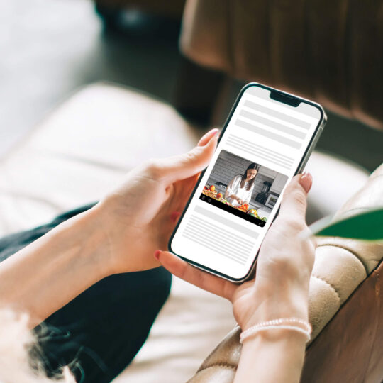 Woman on phone showing outstream video