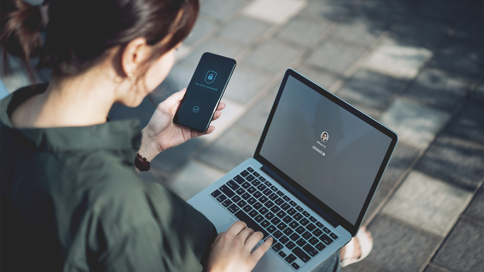 person_using_secure_laptop_in_the_park