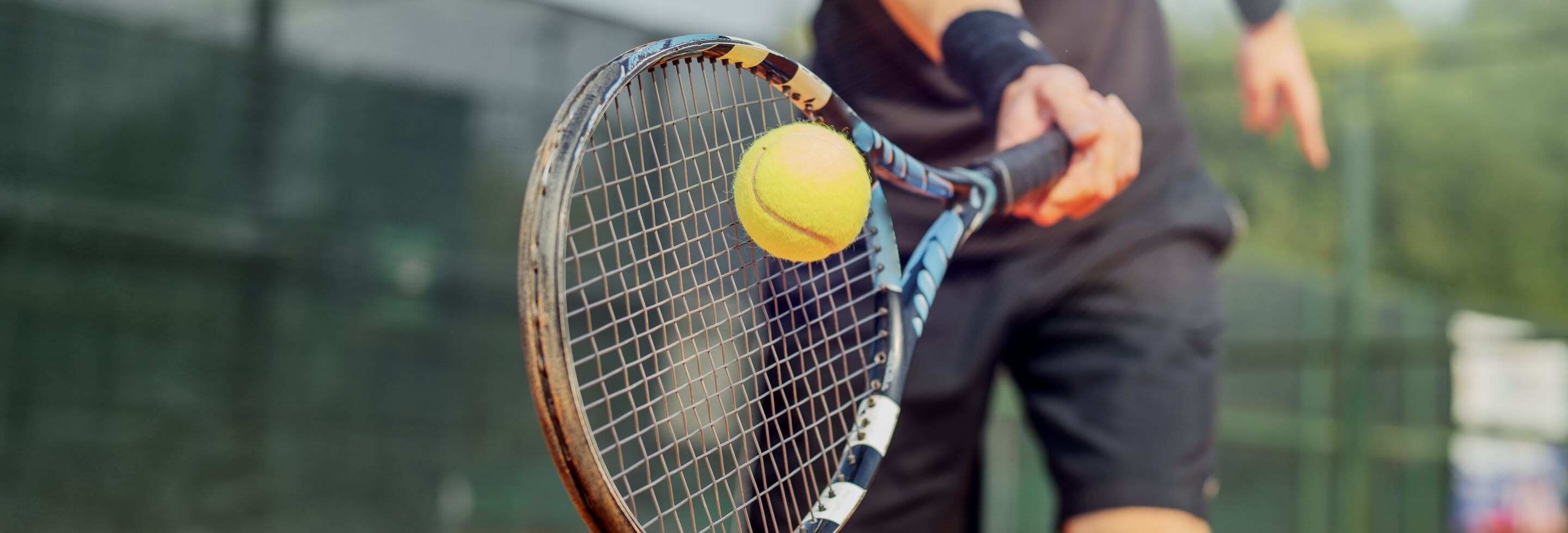 Tennis ball hitting raquet